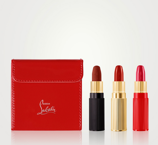 Christian Louboutin On The Go Les Rouges lipstick set with vibrant red shades in sleek packaging, new in box.
