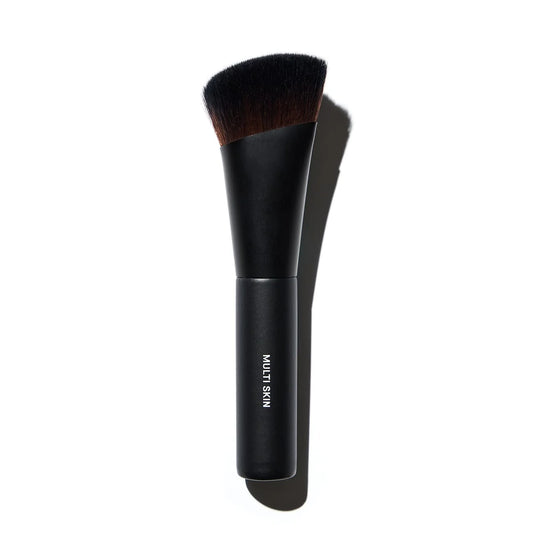 Gee Beauty Multi Skin Brush NIB for beauty skincare, showcasing soft bristles and ergonomic handle for gentle application.