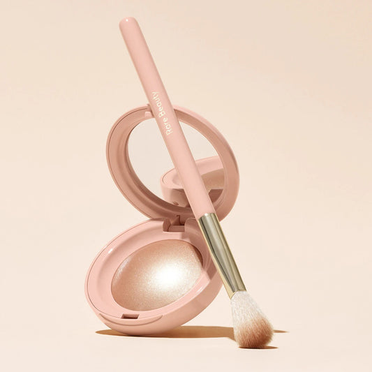 Rare Beauty Positive Light Precision Highlighter Brush, new with sleek handle and soft bristles, for applying highlighter smoothly.