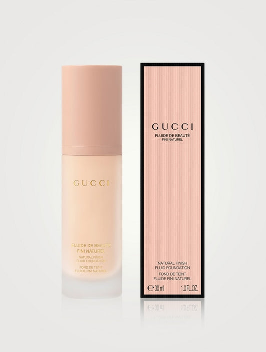 Gucci natural finish fluid foundation bottle with multiple shades, showcasing a sleek, elegant packaging design.