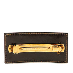 Fendi Zucca canvas barrette hair clip with signature monogram pattern, designed as an elegant hair accessory.
