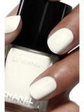 Chanel Vernis Nail Colour bottles in various shades, new in box, showcasing vibrant, glossy nail polish options.