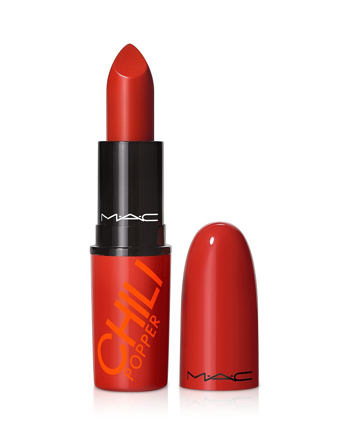M.A.C LustreGlass Sheer-Shine Lipstick in Chili Popper, showing a vibrant coral-red lipstick with a glossy finish.