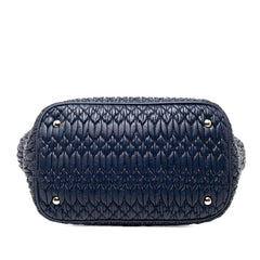 Blue Miu Miu Matelasse Nappa Crystal Satchel bag with quilted design and metallic accents, showcasing a stylish and luxurious look.