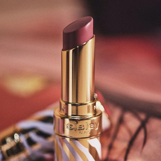 Sisley Phyto-Rouge Shine lipsticks in various shades, new in box, showcasing vibrant color and sleek packaging.