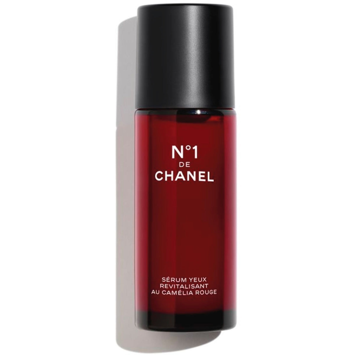 Chanel N°1 de Chanel revitalizing eye serum in 15ml bottle, close-up view showing sleek packaging and branding.