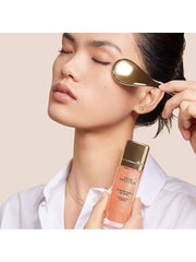 Dior Prestige La Micro-Huile de Rose activated serum and Le Pétale multi-perlé massage tool set displayed on a sleek beauty surface.