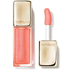 Guerlain KissKiss Bee Glow Honey-Infused Lip Oil in Sparkling Rosewood shade, featuring a sleek tube with applicator and glossy finish.