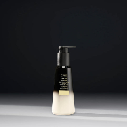 Oribe Gold Lust Restorative Night Crème in a 150ml jar, featuring luxurious gold packaging for nourishing skin care.