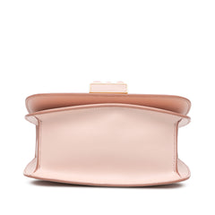 Pink Tom Ford calfskin Lock crossbody bag with sleek design and gold hardware, featuring a compact, stylish look.