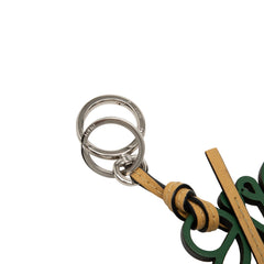 LOEWE leather Anagram key ring and bag charm in vibrant green, featuring the signature LOEWE logo and detailed craftsmanship.