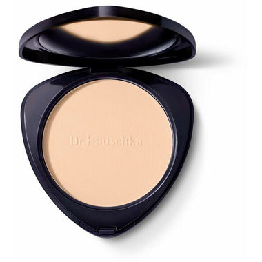 Dr. Hauschka compact powder in shade 00, displayed in a sleek round compact with a mirror, suitable for natural makeup looks.