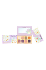 Too Faced Popcorn Balls Eye Shadow Palette with warm-toned eyeshadows in a decorative packaging.