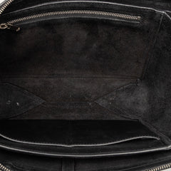 Black Celine trifold leather clutch bag with chain strap, stylish and compact for elegant occasions.