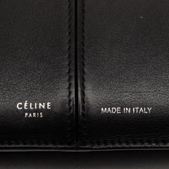 Black Celine trifold leather clutch on chain bag with sleek design and silver hardware, stylish for evening or formal occasions.