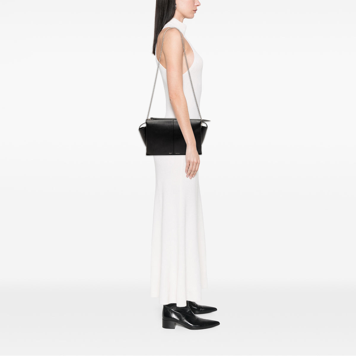 Black Celine trifold leather clutch on chain bag with sleek design and gold-tone hardware, stylish for evening or casual use.