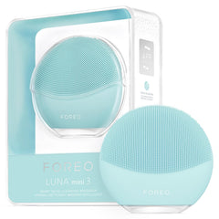 Foreo LUNA mini 3 facial cleansing brush in white, showcasing its compact design and silicone bristles for deep skin cleansing.