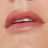 Nudestix Nudescreen Lip Primer SPF 30 in NWOB, close-up of the unopened primer tube with label visible.