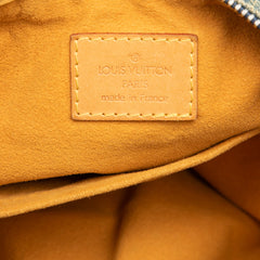 Louis Vuitton Monogram Denim Baggy PM bag showing the spacious design, denim fabric, and signature LV monogram pattern.