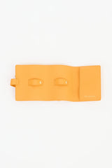 Yellow Bvlgari leather travel watch case with sleek design, new in box, for protecting and organizing luxury watches.