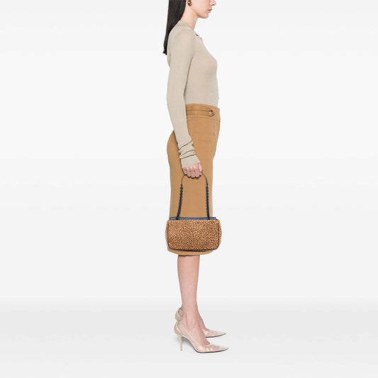 Bottega Veneta leopard print shoulder bag made from pony hair with a stylish, textured design and a sleek shoulder strap.