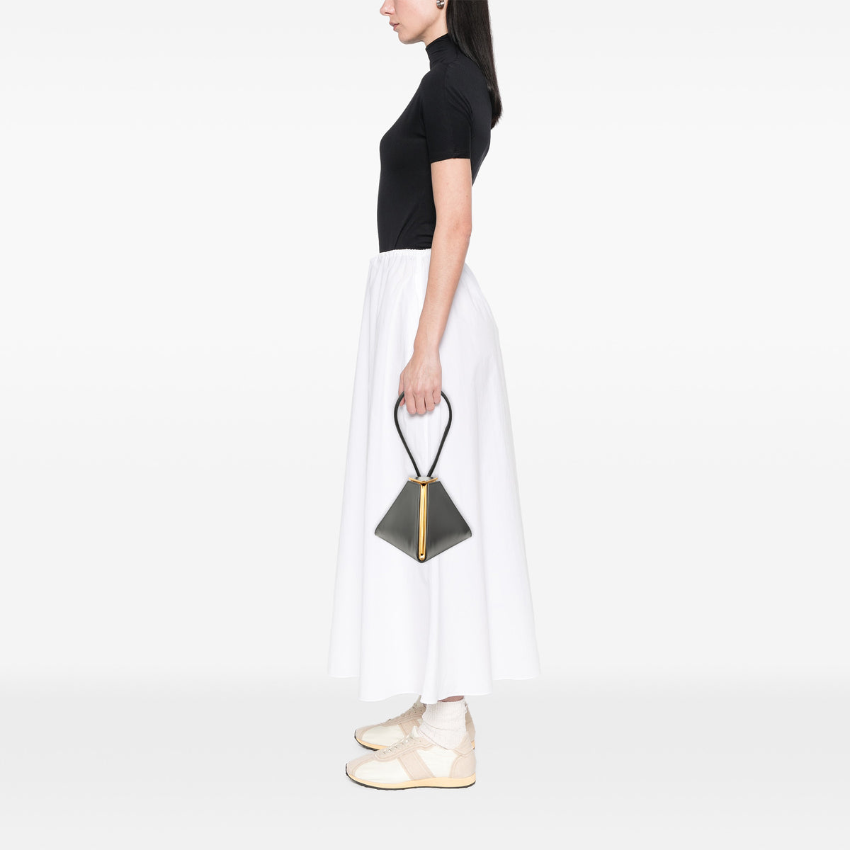 Black Bottega Veneta calfskin pyramid handbag with structured design and top handle, showcasing luxury craftsmanship.