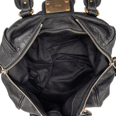 Black Chloé Leather Paddington Shoulder Bag with top handles and signature hardware, showcasing its elegant design and craftsmanship.