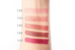 Chanel Rouge Coco Ultra Hydrating Lip Colour in various shades, featuring a close-up of the lipstick tube and color swatches.