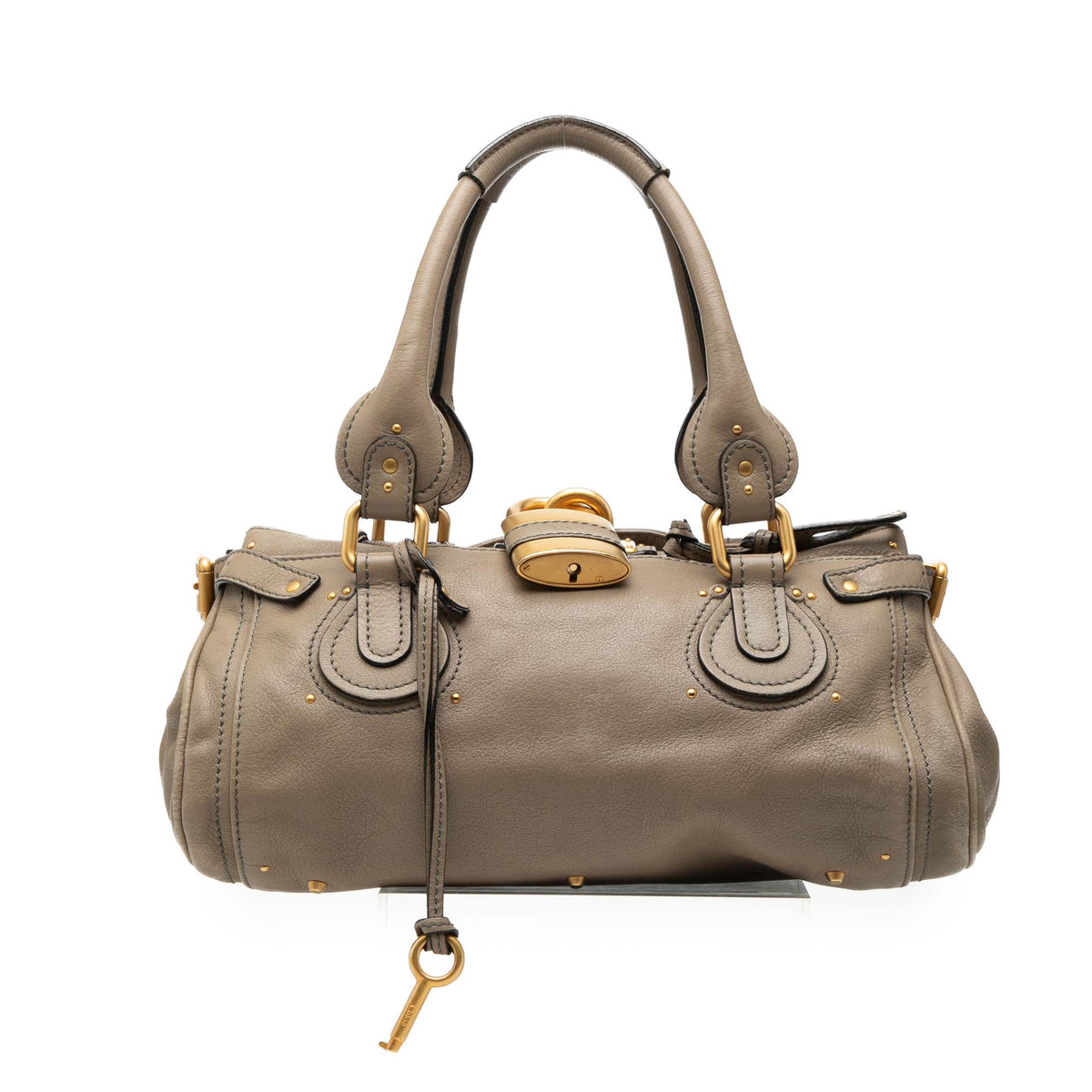 Chloé Medium Leather Paddington Handbag in beige with gold hardware, showcasing its stylish design and structured shape.