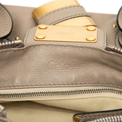 Chloé Medium Leather Paddington Handbag in tan with gold hardware, featuring top handles and a structured bag design.