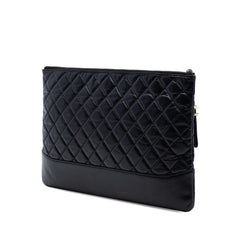 Pre-owned Chanel large calfskin Gabrielle O case clutch in black, featuring a textured aged leather finish and sleek design.