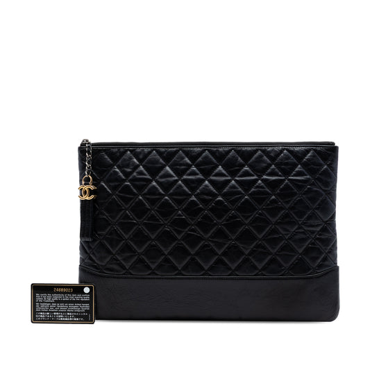 Pre-owned black Chanel Gabrielle calfskin clutch bag with gold hardware, large aged leather design and signature Chanel style.