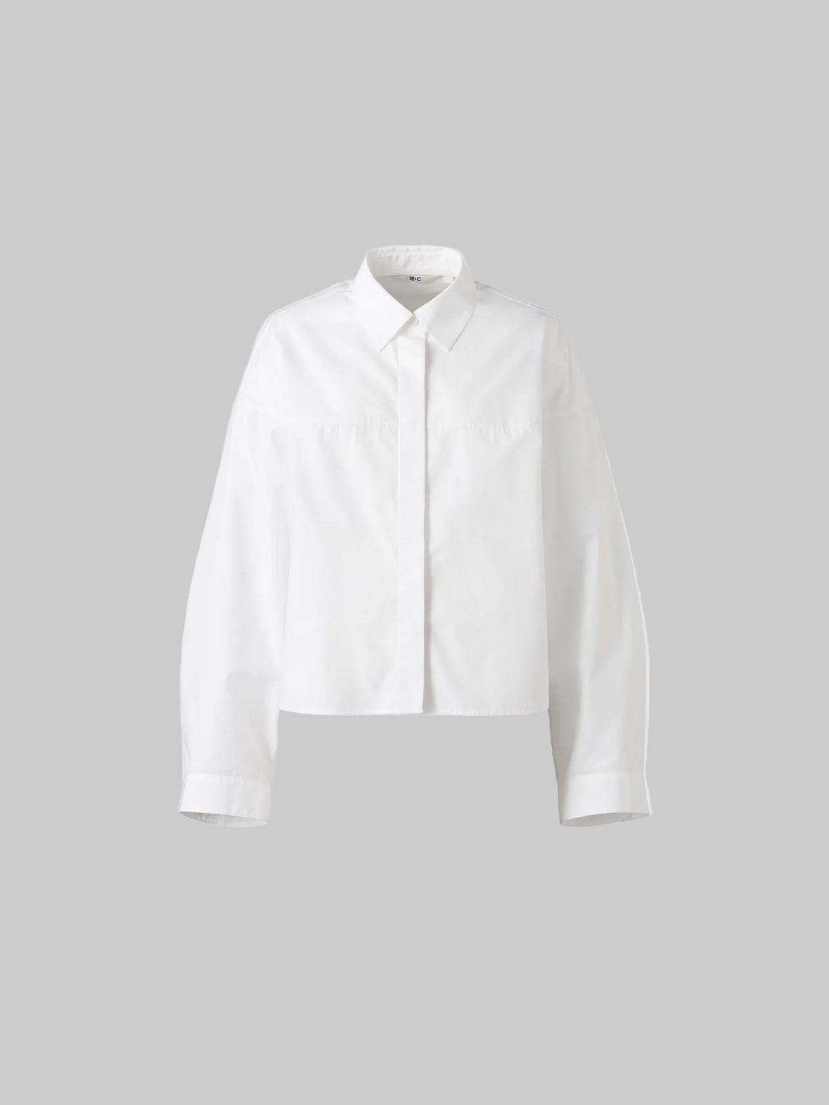 Uniqlo cotton cocoon shirt in size XL, new with tags, featuring a relaxed fit and soft cotton fabric.