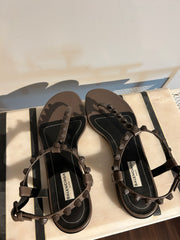Balenciaga Arena sandals in size 35.5, featuring sleek black leather straps and chunky rubber soles for a modern look.