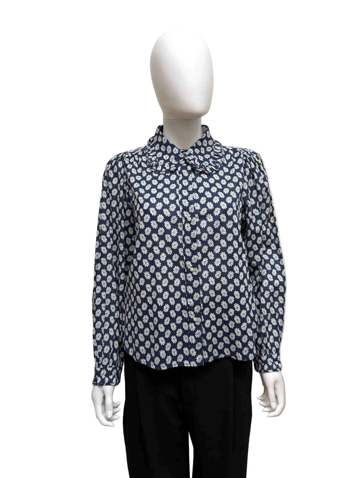 The Great Cotton Daisy Blouse, light blue with white floral print, featuring a relaxed fit and classic collar.