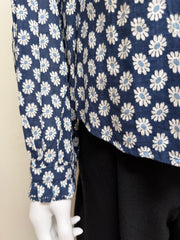 The Great Cotton Daisy Blouse, light blue with floral pattern, featuring a classic collar and button-down front.