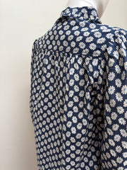The Great Cotton Daisy Blouse, light blue button-up shirt with ruffled collar and floral embroidery, casual women's clothing.