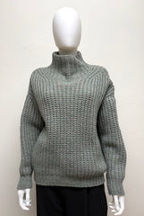 Isabel Marant Iris sweater, cozy knit clothing with a relaxed fit, featuring neutral tones and textured fabric, front view.