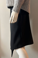Black Acne asymmetrical hoist skirt size 38/6, featuring a modern design and tailored fit, shown on a white background.