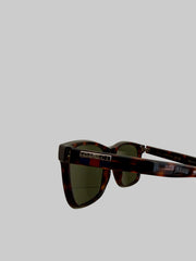 Gucci GG0746S 001 sunglasses with black frames and dark lenses, stylish accessory for sun protection and fashion.