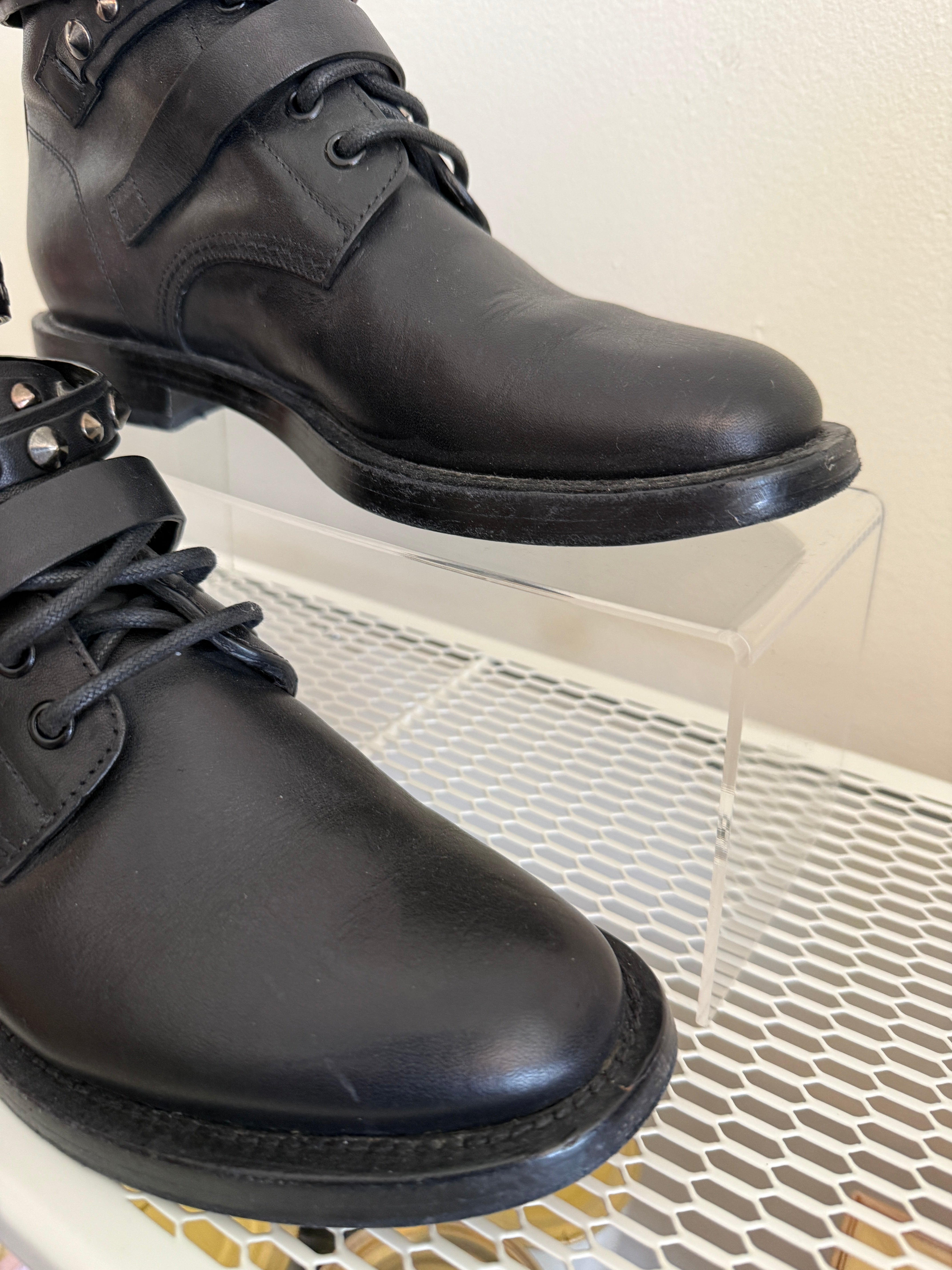 Yves Saint Laurent Ranger Stud Boot in size 37.5 with wrap straps, black leather ankle shoes with studded detailing.