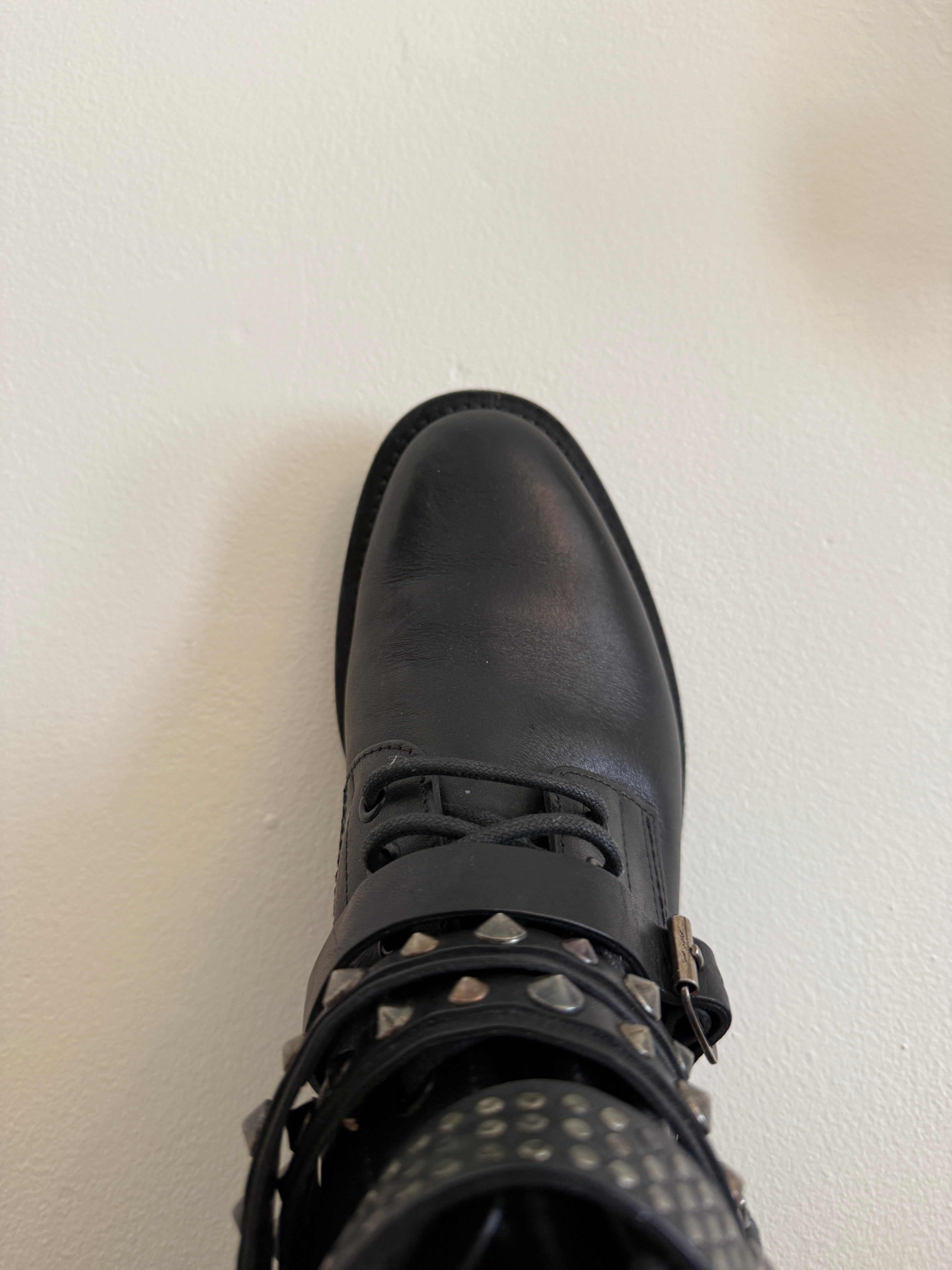 Yves Saint Laurent Ranger Stud Boot with wrap straps in size 37.5, featuring black leather and studded detailing.