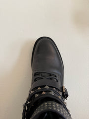 Yves Saint Laurent Ranger Stud Boot with wrap straps in size 37.5, featuring black leather and studded detailing.