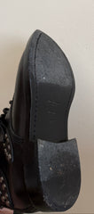 Yves Saint Laurent Ranger Stud Boot with wrap straps in size 37.5, showcasing black leather shoes with stud details.