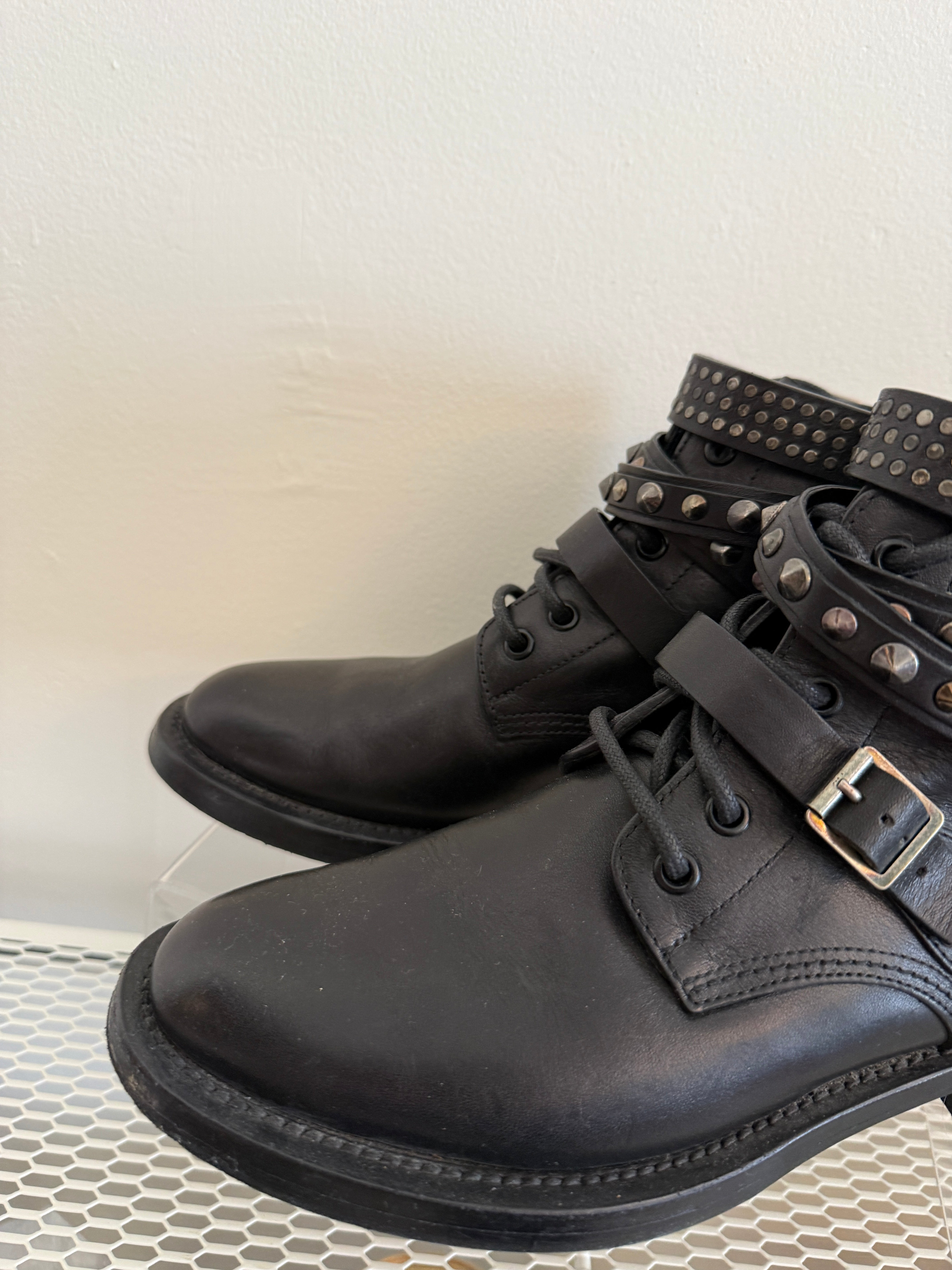 Yves Saint Laurent Ranger Stud Boot with wrap straps in size 37.5, showcasing black leather shoes with studded detailing.