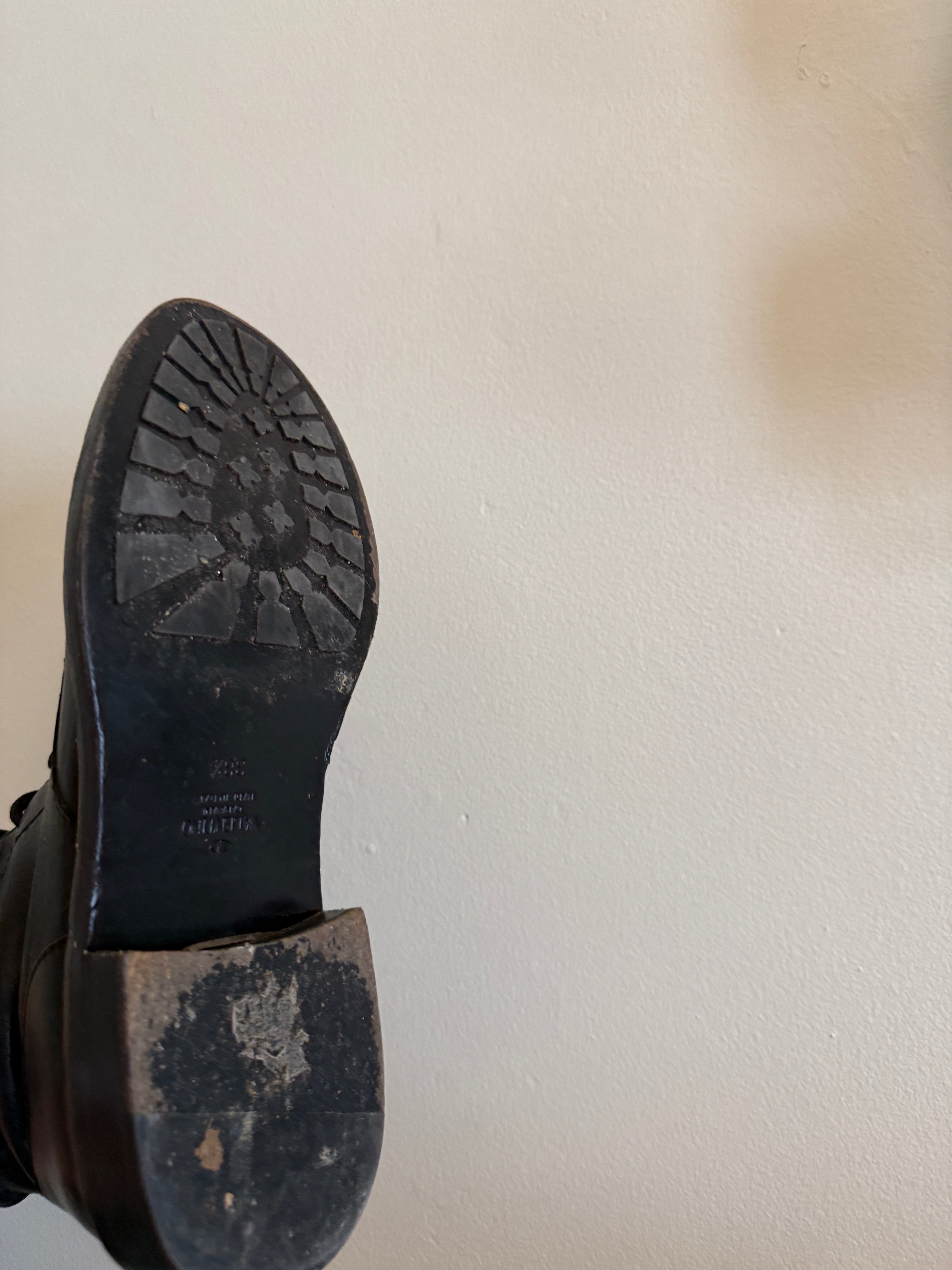 Valentino Rock Stud Combat Boots size 38.5 with black leather and signature stud embellishments, front view.