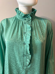 Light beige Masscob Dunne Dress in size S, displayed on a hanger with a soft, flowy fabric and subtle detailing.