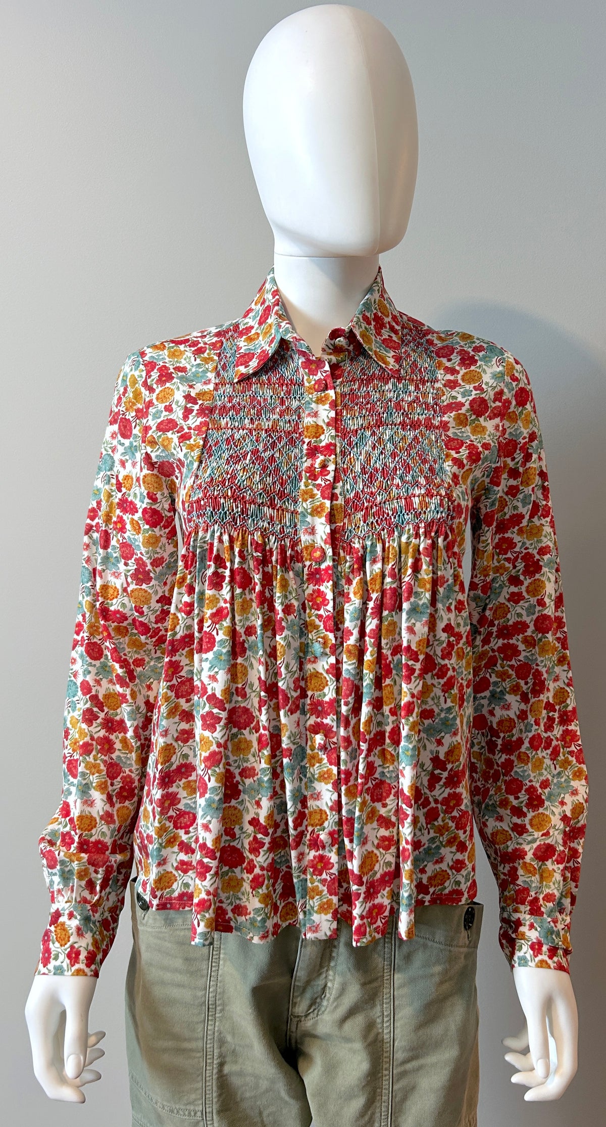 Loretta Caponi floral blouse in size small, featuring delicate floral pattern, lightweight fabric, and elegant design.