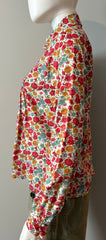 Loretta Caponi floral blouse in small size, showcasing elegant fabric with vibrant floral patterns and classic design.