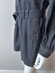 Ulla Johnson black denim romper size 2, casual clothing with long sleeves and a relaxed fit, displayed on a hanger.